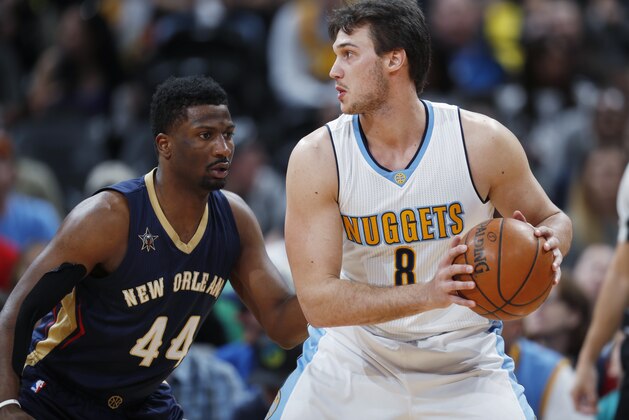 Denver Nuggets forward Danilo Gallinari, right, of Italy, looks to pass the ball as New Orleans Pelicans forward Solomon Hill defends during the first half of an NBA basketball game Friday, April 7, 2017, in Denver. (AP Photo/David Zalubowski) Denver Nuggets forward Danilo Gallinari, right, of Italy, looks to pass the ball as New Orleans Pelicans forward Solomon Hill defends during the first half of an NBA basketball game Friday, April 7, 2017, in Denver. (AP Photo/David Zalubowski)