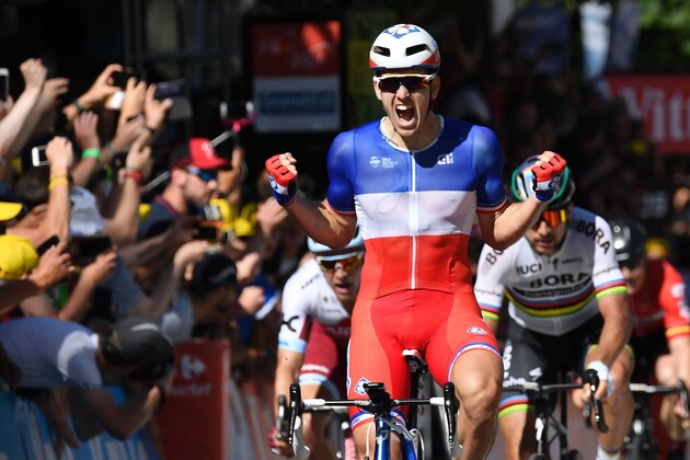 France's Arnaud Demare celebrates as he crosses the finish line ahead of Slovakia's Peter Sagan (R) and Norway's Alexander Kristoff (L) at the end of the 207,5 km fourth stage of the 104th edition of the Tour de France cycling race on July 4, 2017 between Mondorf-les-Bains and Vittel. / AFP PHOTO / Lionel BONAVENTURE        (Photo credit should read LIONEL BONAVENTURE/AFP/Getty Images)