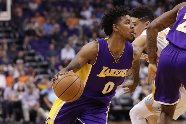 Los Angeles Lakers guard Nick Young (0) drives against the Phoenix Suns during the first half of an NBA basketball game, Thursday, March 9, 2017, in Phoenix. (AP Photo/Matt York)