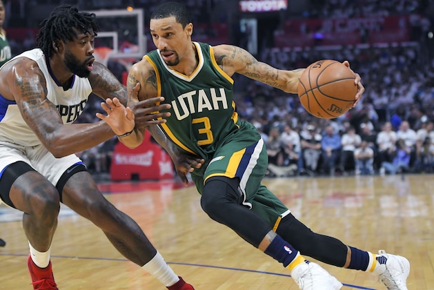 FILE - In this April 30, 2017, file photo, Utah Jazz guard George Hill, right, drives past Los Angeles Clippers center DeAndre Jordan during Game 7 of an NBA basketball first-round playoff series in Los Angeles.  Hill gave the Jazz their best point guard production since Deron Williams was traded in 2011. Hill, however, is a free agent. (AP Photo/Mark J. Terrill, File)