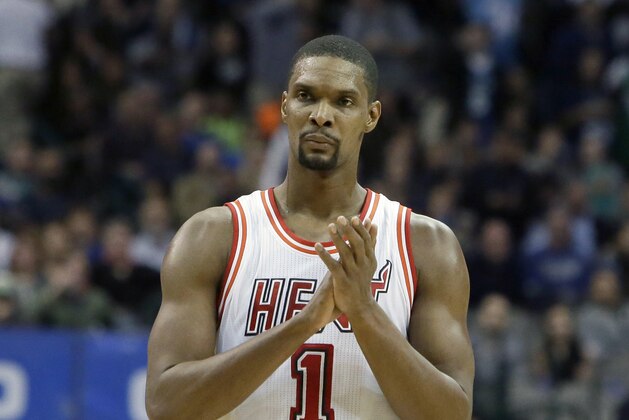 FILE - In this Feb. 3, 2016, file photo, Miami Heat forward Chris Bosh (1) reacts to a call during the second half of an NBA basketball game against the Dallas Mavericks, in Dallas. Bosh was dealing with more than one blood clot earlier this year, and said Wednesday, Sept. 21, 2016,  that he felt written off when Miami Heat team doctors advised him that the situation would likely be career-ending. (AP Photo/LM Otero, File)