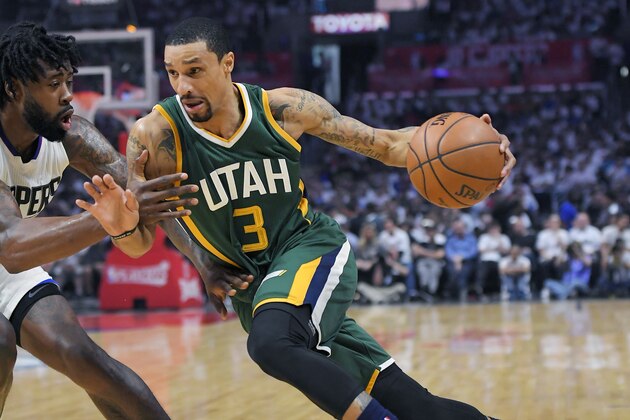 FILE - In this April 30, 2017, file photo, Utah Jazz guard George Hill, right, drives past Los Angeles Clippers center DeAndre Jordan during Game 7 of an NBA basketball first-round playoff series in Los Angeles.  Hill gave the Jazz their best point guard production since Deron Williams was traded in 2011. Hill, however, is a free agent. (AP Photo/Mark J. Terrill, File)