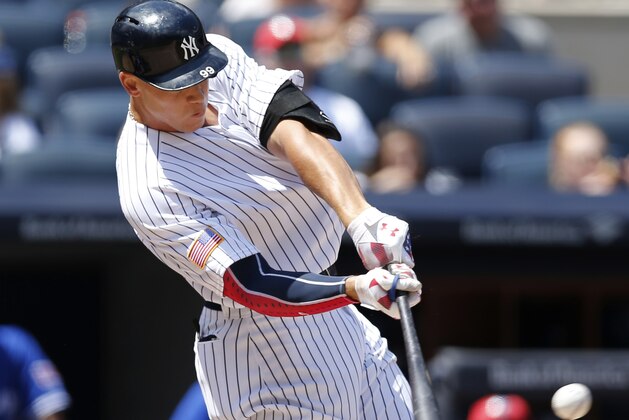 New York Yankees' Aaron Judge hits a solo home run during the fourth inning of a baseball game against the Toronto Blue Jays in New York, Tuesday, July 4, 2017. (AP Photo/Kathy Willens)