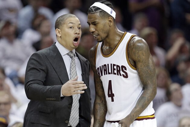 Cleveland Cavaliers head coach Tyronn Lue talks with Iman Shumpert in the second half in Game 2 of a first-round NBA basketball playoff series, Monday, April 17, 2017, in Cleveland. The Cavaliers won 117-111. (AP Photo/Tony Dejak)