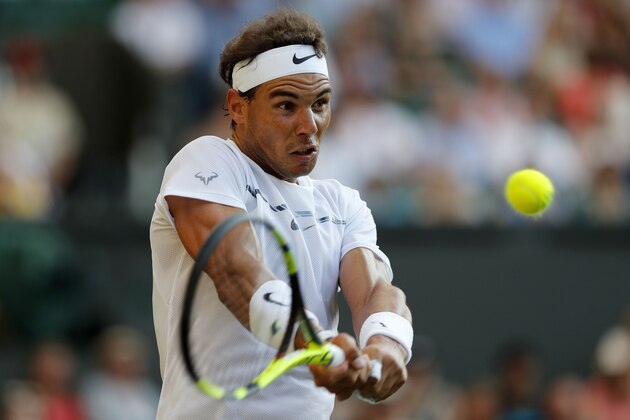 Spain's Rafael Nadal returns against US player Donald Young during their men's singles second round match on the third day of the 2017 Wimbledon Championships at The All England Lawn Tennis Club in Wimbledon, southwest London, on July 5, 2017. / AFP PHOTO / Adrian DENNIS / RESTRICTED TO EDITORIAL USE (Photo credit should read ADRIAN DENNIS/AFP/Getty Images) Spain's Rafael Nadal returns against US player Donald Young during their men's singles second round match on the third day of the 2017 Wimbledon Championships at The All England Lawn Tennis Club in Wimbledon, southwest London, on July 5, 2017. / AFP PHOTO / Adrian DENNIS / RESTRICTED TO EDITORIAL USE (Photo credit should read ADRIAN DENNIS/AFP/Getty Images)