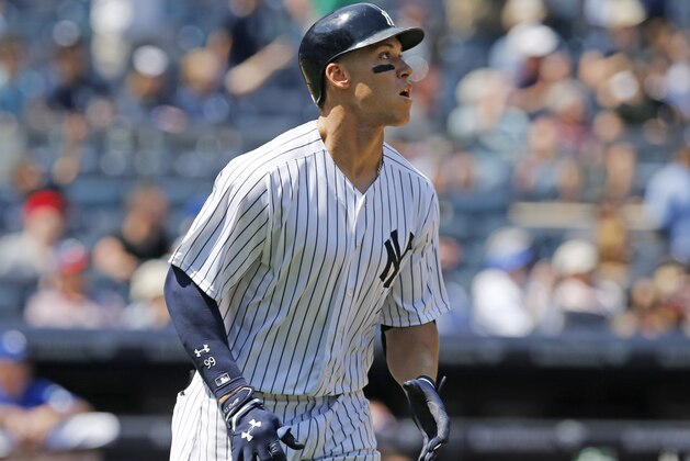 New York Yankees' Aaron Judge watches his two-run home run in the fourth inning of a baseball game against the Toronto Blue Jays in New York, Wednesday, July 5, 2017. (AP Photo/Kathy Willens)