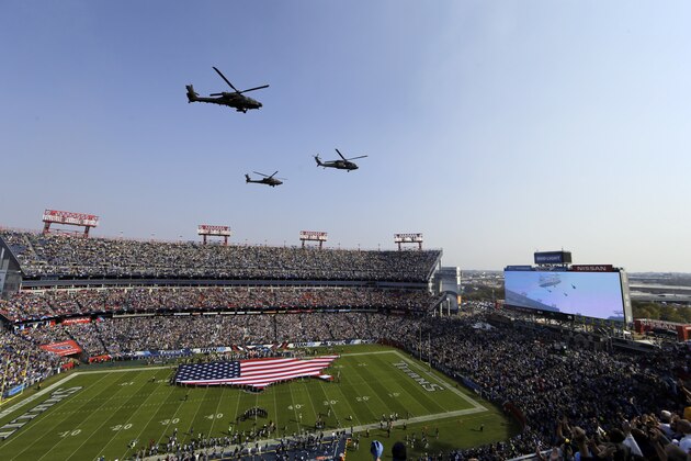 Helicopters fly over Nissan Stadium as part of the Salute to Service pregame ceremony before an NFL football game between the Tennessee Titans and the Green Bay Packers Sunday, Nov. 13, 2016, in Nashville, Tenn. (AP Photo/James Kenney)