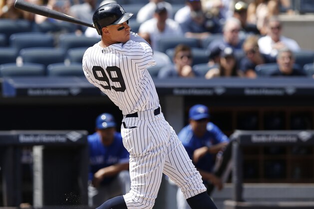 New York Yankees right fielder Aaron Judge (99) hits a fifth-inning single with two runners on base in a baseball game against the Toronto Blue Jays in New York, Wednesday, July 5, 2017. (AP Photo/Kathy Willens)