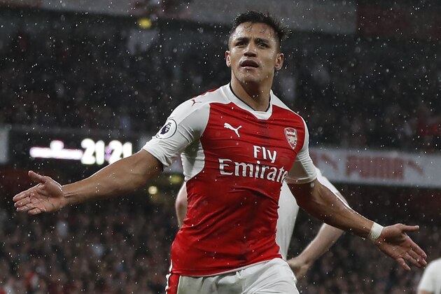 Arsenal's Chilean striker Alexis Sanchez celebrates scoring the second goal during the English Premier League football match between Arsenal and Sunderland at the Emirates Stadium in London on May 16, 2017.  / AFP PHOTO / Adrian DENNIS / RESTRICTED TO EDITORIAL USE. No use with unauthorized audio, video, data, fixture lists, club/league logos or 'live' services. Online in-match use limited to 75 images, no video emulation. No use in betting, games or single club/league/player publications.  /         (Photo credit should read ADRIAN DENNIS/AFP/Getty Images)