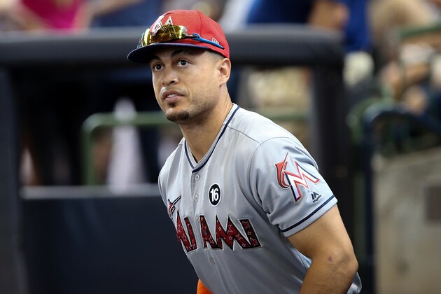 MILWAUKEE, WI - JULY 02:  Giancarlo Stanton #27 of the Miami Marlins walks through the dugout before the game against the Milwaukee Brewers at Miller Park on July 02, 2017 in Milwaukee, Wisconsin. (Photo by Dylan Buell/Getty Images)