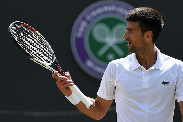 Serbia's Novak Djokovic reacts to a spectator during his match against Czech Republic's Adam Pavlasek during their men's singles second round match on the fourth day of the 2017 Wimbledon Championships at The All England Lawn Tennis Club in Wimbledon, southwest London, on July 6, 2017.
Djokovic won the match 6-2, 6-2, 6-1. / AFP PHOTO / Glyn KIRK / RESTRICTED TO EDITORIAL USE        (Photo credit should read GLYN KIRK/AFP/Getty Images)