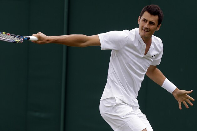 Australia's Bernard Tomic returns to Germany's Mischa Zverev during their Men's Singles Match on day two at the Wimbledon Tennis Championships in London Tuesday, July 4, 2017. (AP Photo/Alastair Grant)