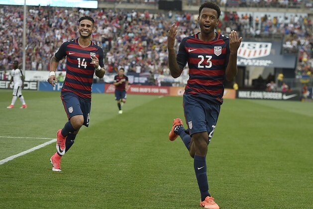 United States' Kellyn Acosta celebrates his goal against Ghana as teammate United States' Dom Dwyer, left, smiles behind him during an international friendly soccer match at Pratt & Whitney Stadium at Rentschler Field, Saturday, July 1, 2017, in East Hartford, Conn. The USA won 2-1. (AP Photo/Jessica Hill)