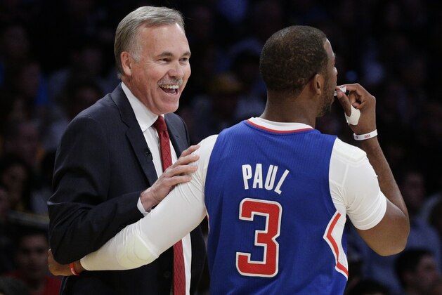 Los Angeles Lakers head coach Mike D'Antoni, left, greets Los Angeles Clippers' Chris Paul before an NBA basketball game on Thursday, March 6, 2014, in Los Angeles. (AP Photo/Jae C. Hong)