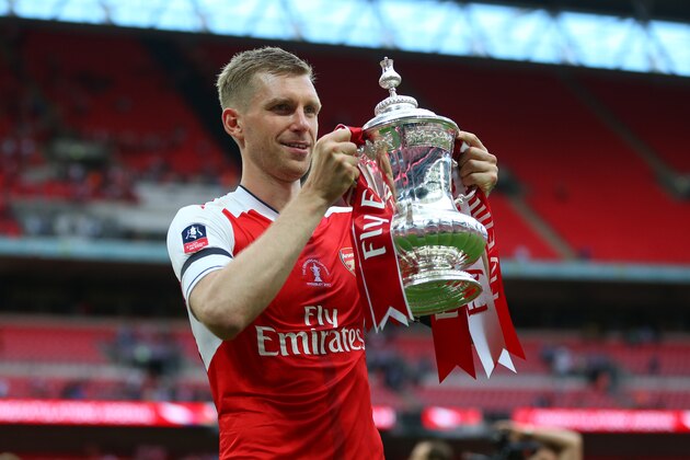 LONDON, ENGLAND - MAY 27: Per Mertesacker of Arsenal celebrates with the trophy during the Emirates FA Cup Final match between Arsenal and Chelsea at Wembley Stadium on May 27, 2017 in London, England. (Photo by Catherine Ivill - AMA/Getty Images)