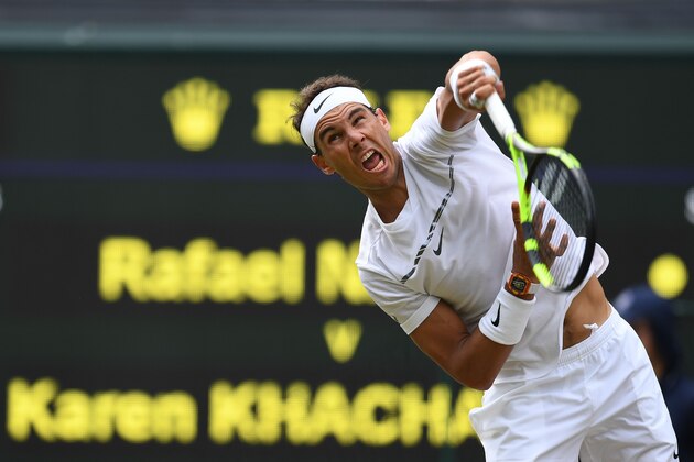 Spain's Rafael Nadal serves against Russia's Karen Khachanov during their men's singles third round match on the fifth day of the 2017 Wimbledon Championships at The All England Lawn Tennis Club in Wimbledon, southwest London, on July 7, 2017. / AFP PHOTO / Glyn KIRK / RESTRICTED TO EDITORIAL USE (Photo credit should read GLYN KIRK/AFP/Getty Images) Spain's Rafael Nadal serves against Russia's Karen Khachanov during their men's singles third round match on the fifth day of the 2017 Wimbledon Championships at The All England Lawn Tennis Club in Wimbledon, southwest London, on July 7, 2017. / AFP PHOTO / Glyn KIRK / RESTRICTED TO EDITORIAL USE (Photo credit should read GLYN KIRK/AFP/Getty Images)