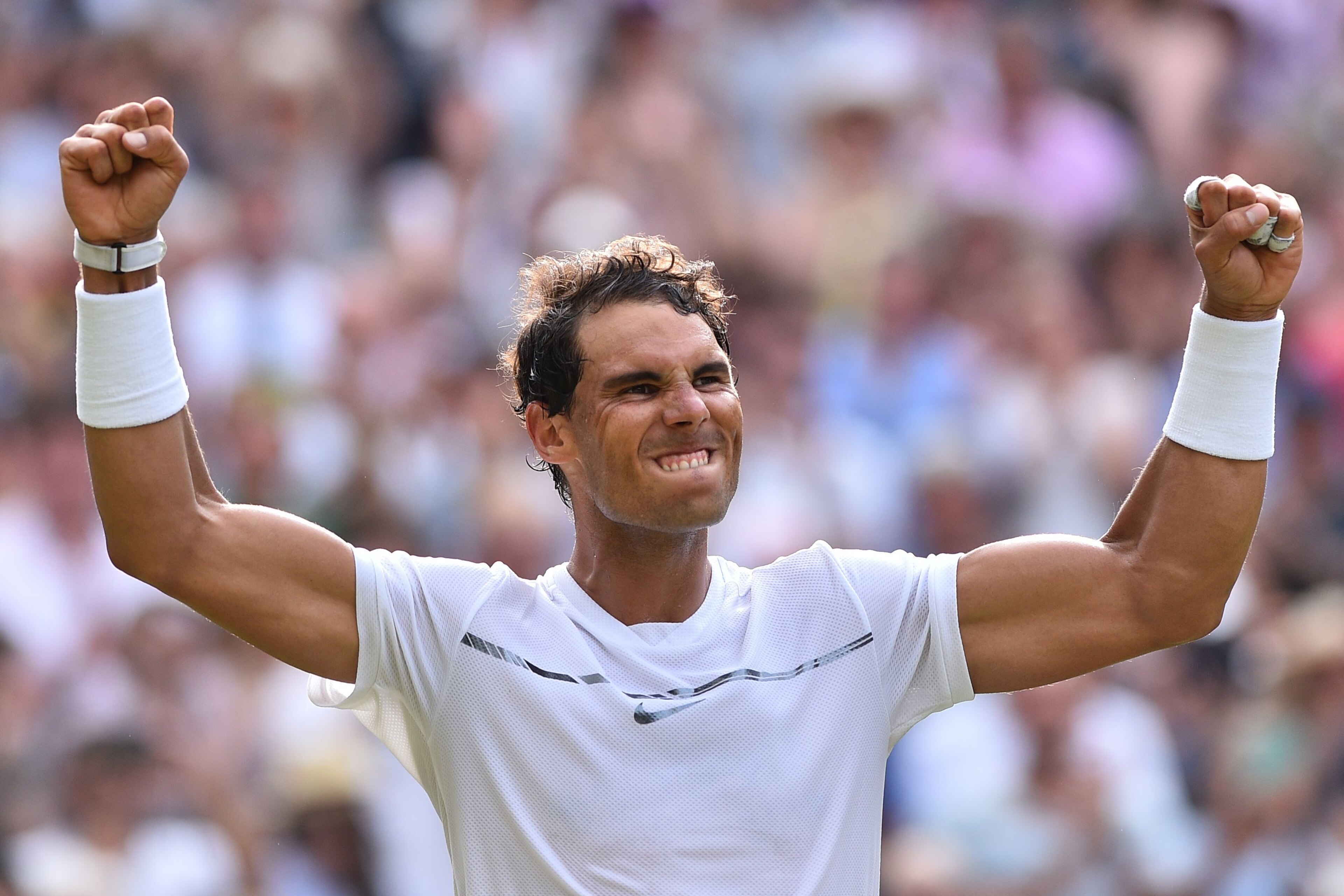 Spain's Rafael Nadal celebrates beating Russia's Karen Khachanov during their men's singles third round match on the fifth day of the 2017 Wimbledon Championships at The All England Lawn Tennis Club in Wimbledon, southwest London, on July 7, 2017. / AFP PHOTO / Glyn KIRK / RESTRICTED TO EDITORIAL USE        (Photo credit should read GLYN KIRK/AFP/Getty Images)