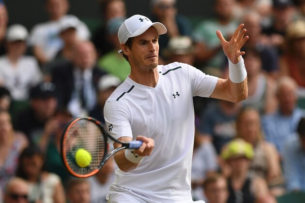 Britain's Andy Murray returns against Italy's Fabio Fognini during their men's singles third round match on the fifth day of the 2017 Wimbledon Championships at The All England Lawn Tennis Club in Wimbledon, southwest London, on July 7, 2017. / AFP PHOTO / Glyn KIRK / RESTRICTED TO EDITORIAL USE        (Photo credit should read GLYN KIRK/AFP/Getty Images)