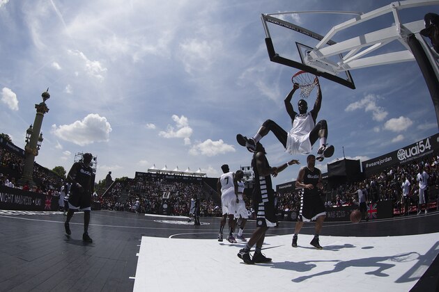 Players take part in the 12th edition of the Quai 54 World Streetball basketball championship, on June 13, 2015 at the Place de la Concorde, in Paris. AFP PHOTO / JOEL SAGET        (Photo credit should read JOEL SAGET/AFP/Getty Images)