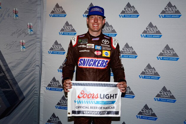 SPARTA, KY - JULY 07: Kyle Busch, driver of the #18 Snickers Toyota, poses for a photo after winning the pole award during qualifying for the Monster Energy NASCAR Cup Series Quaker State 400 presented by Advance Auto Parts at Kentucky Speedway on July 7, 2017 in Sparta, Kentucky. (Photo by Robert Laberge/Getty Images)