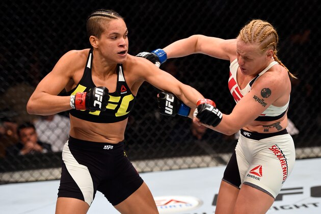 LAS VEGAS, NV - MARCH 05:  (L-R) Amanda Nunes of Brazil punches Valentina Schevchenko in their women's bantamweight bout during the UFC 196 event inside the MGM Grand Garden Arena on March 5, 2016 in Las Vegas, Nevada. (Photo by Josh Hedges/Zuffa LLC/Zuffa LLC via Getty Images)