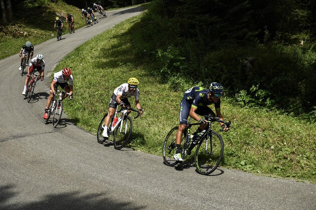 TOPSHOT - (From R) Costa Rica's Audrey Amador and Colombia's Sergio Henao rides during the 187,5 km eighth stage of the 104th edition of the Tour de France cycling race on July 8, 2017 between Dole and Station des Rousses. / AFP PHOTO / Lionel BONAVENTURE        (Photo credit should read LIONEL BONAVENTURE/AFP/Getty Images)