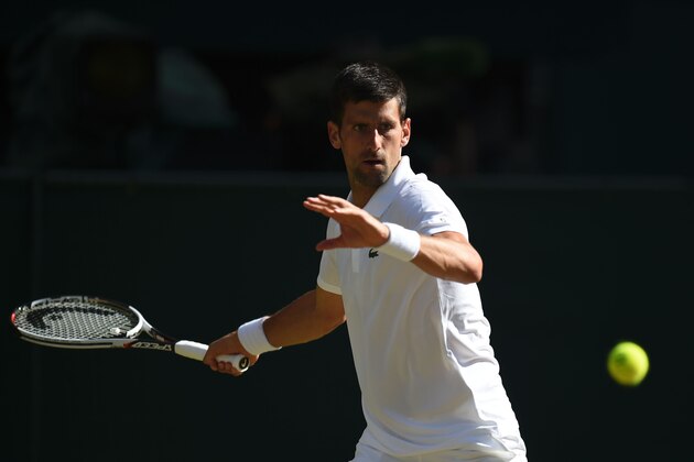 Serbia's Novak Djokovic returns against Latvia's Ernests Gulbis during their men's singles third round match on the sixth day of the 2017 Wimbledon Championships at The All England Lawn Tennis Club in Wimbledon, southwest London, on July 8, 2017. / AFP PHOTO / Oli SCARFF / RESTRICTED TO EDITORIAL USE (Photo credit should read OLI SCARFF/AFP/Getty Images) Serbia's Novak Djokovic returns against Latvia's Ernests Gulbis during their men's singles third round match on the sixth day of the 2017 Wimbledon Championships at The All England Lawn Tennis Club in Wimbledon, southwest London, on July 8, 2017. / AFP PHOTO / Oli SCARFF / RESTRICTED TO EDITORIAL USE (Photo credit should read OLI SCARFF/AFP/Getty Images)