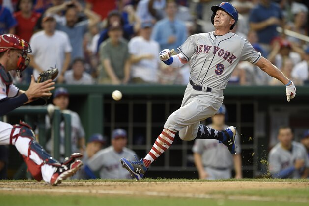 New York Mets' Brandon Nimmo (9) runs towards home against Washington Nationals catcher Matt Wieters, left, during the eighth inning of a baseball game, Monday, July 3, 2017, in Washington. Nimmo was out at home on the play. The Nationals won 3-2. (AP Photo/Nick Wass)