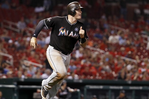 Miami Marlins' Justin Bour watches his solo home run during the ninth inning of the team's baseball game against the St. Louis Cardinals Wednesday, July 5, 2017, in St. Louis. (AP Photo/Jeff Roberson)