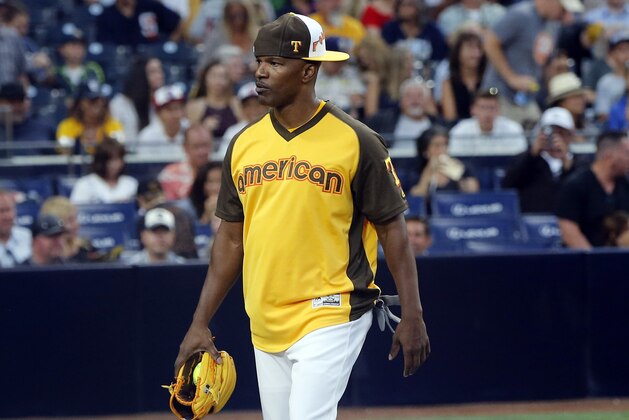 Actor Jaime Foxx takes the field during the All-Star Legends & Celebrity Softball game, Sunday, July 10, 2016, in San Diego. (AP Photo/Lenny Ignelzi)