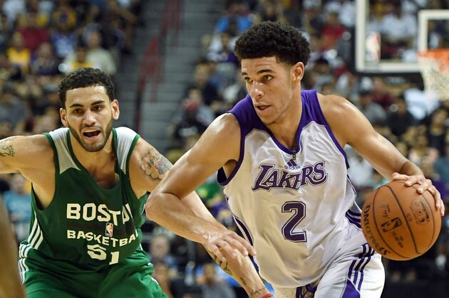 LAS VEGAS, NV - JULY 08:  Lonzo Ball #2 of the Los Angeles Lakers drives against Abdel Nader #51 of the Boston Celtics during the 2017 Summer League at the Thomas & Mack Center on July 8, 2017 in Las Vegas, Nevada. Boston won 86-81. NOTE TO USER: User expressly acknowledges and agrees that, by downloading and or using this photograph, User is consenting to the terms and conditions of the Getty Images License Agreement.  (Photo by Ethan Miller/Getty Images)