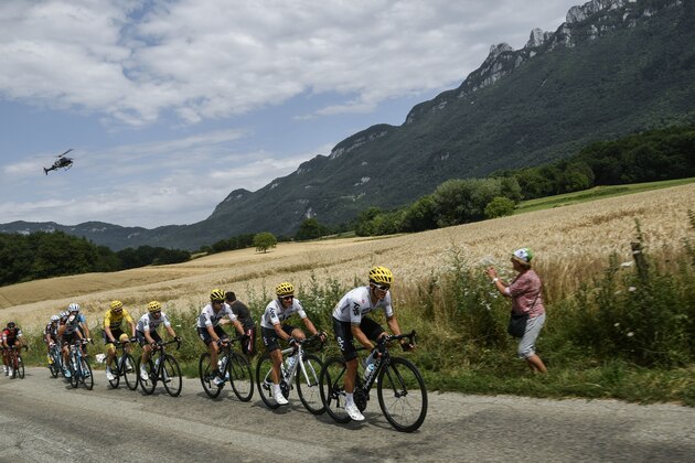 Riders of the Great Britain's Sky cycling team: (From R) Poland's Michal Kwiatkowski, Colombia's Sergio Henao, Spain's Mikel Landa, Spain's Mikel Nieve and Great Britain's Christopher Froome, wearing the overall leader's yellow jersey, ride as a media helicopter flies over during the 181,5 km ninth stage of the 104th edition of the Tour de France cycling race on July 9, 2017 between Nantua and Chambery. / AFP PHOTO / PHILIPPE LOPEZ (Photo credit should read PHILIPPE LOPEZ/AFP/Getty Images) Riders of the Great Britain's Sky cycling team: (From R) Poland's Michal Kwiatkowski, Colombia's Sergio Henao, Spain's Mikel Landa, Spain's Mikel Nieve and Great Britain's Christopher Froome, wearing the overall leader's yellow jersey, ride as a media helicopter flies over during the 181,5 km ninth stage of the 104th edition of the Tour de France cycling race on July 9, 2017 between Nantua and Chambery. / AFP PHOTO / PHILIPPE LOPEZ (Photo credit should read PHILIPPE LOPEZ/AFP/Getty Images)