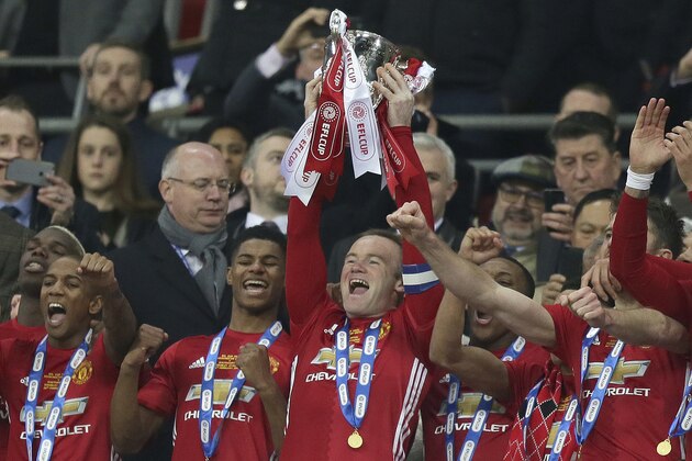 Manchester United's Wayne Rooney lifts the trophy after winning the English League Cup final soccer match between Manchester United and Southampton FC at Wembley stadium in London, Sunday, Feb. 26, 2017. (AP Photo/Tim Ireland)