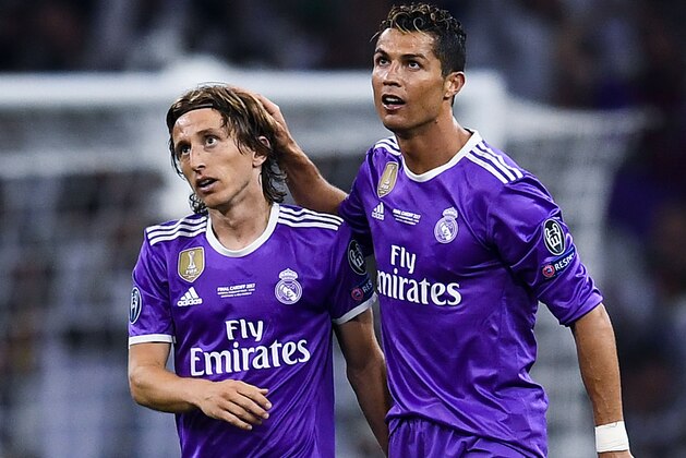 CARDIFF, WALES - JUNE 03:  Cristiano Ronaldo (R) of Real Madrid CF celebrates with his team mate Luka Modric after scoring his team's third goal during the UEFA Champions League Final between Juventus and Real Madrid at National Stadium of Wales on June 3, 2017 in Cardiff, Wales.  (Photo by David Ramos/Getty Images)