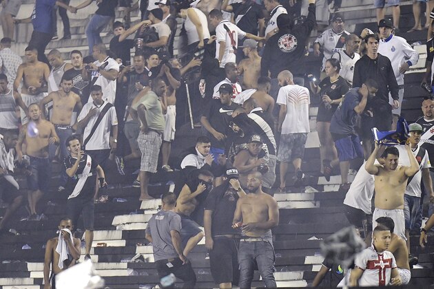 RIO DE JANEIRO, BRAZIL - JULY 08: Vasco fans get angry arter defeat in the game and come into confrontation with the police after the match between Vasco da Gama and Flamengo as part of Brasileirao Series A 2017 at Sao Januario Stadium on July 08, 2017 in Rio de Janeiro, Brazil. (Photo by Alexandre Loureiro/Getty Images)