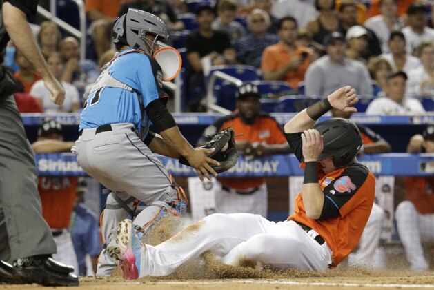 U.S. Team's Chance Sisco, of the Baltimore Orioles, right, beats the throw to World Team catcher Francisco Mejia, of the Cleveland Indians, to score during the second inning of the All-Star Futures baseball game, Sunday, July 9, 2017, in Miami. (AP Photo/Lynne Sladky)