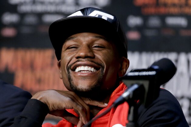 FILE - In this April 29, 2015, file photo, boxer Floyd Mayweather Jr. smiles during a pre-fight news conference in Las Vegas. Mayweather is being inducted into the Southern Nevada Sports Hall of Fame in Las Vegas on Friday, June 2, 2017. (AP Photo/Chris Carlson, File)