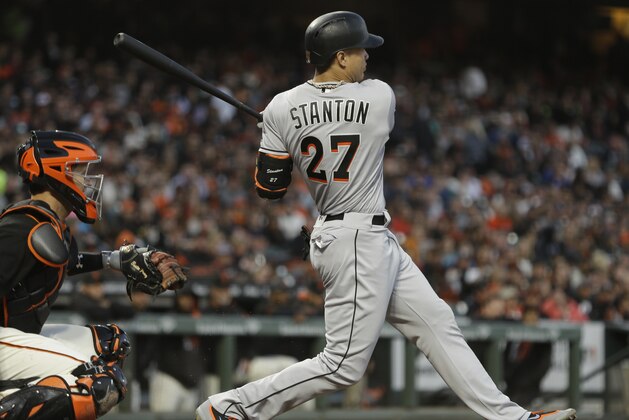 Miami Marlins' Giancarlo Stanton swings for a double off San Francisco Giants' Jeff Samardzija in the fifth inning of a baseball game Saturday, July 8, 2017, in San Francisco. (AP Photo/Ben Margot)
