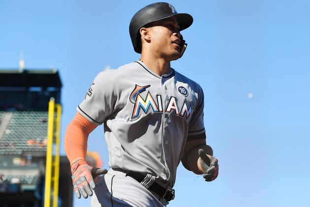 SAN FRANCISCO, CA - JULY 09:  Giancarlo Stanton #27 of the Miami Marlins trots back to the dugout after hitting a solo home run against the San Francisco Giants in the top of the 11th inning at AT&T Park on July 9, 2017 in San Francisco, California.  (Photo by Thearon W. Henderson/Getty Images)