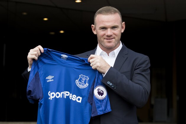LIVERPOOL, ENGLAND - JULY 10: Wayne Rooney holds up his new Everton shirt at Goodison Park on July 10, 2017 in Liverpool, England. (Photo by Mark Robinson/Getty Images)