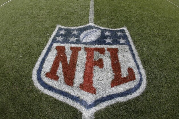 The NFL shield logo is shown painted on the field at Sports Authority Field at Mile High before an NFL football game between the Denver Broncos and the Oakland Raiders, Sunday, Jan. 1, 2017, in Denver. (AP Photo/Jack Dempsey)