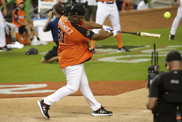 National League's Livian Hernandez hits a grand slam during the the All-Star Celebrity Softball game, Sunday, July 9, 2017, in Miami. (AP Photo/Lynne Sladky)