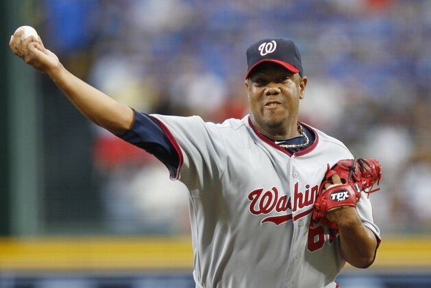 Washington Nationals starting pitcher Livan Hernandez works in the first inning of a baseball game against the Atlanta Braves in Atlanta on Friday, July 15, 2011. (AP Photo/John Bazemore)