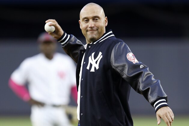 Retired New York Yankees shortstop Derek Jeter throws out the ceremonial first pitch after a ceremony retiring his number 2 in Monument Park at Yankee Stadium in New York, Sunday, May 14, 2017. (AP Photo/Kathy Willens, Pool)