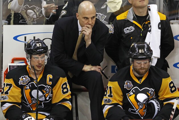 Pittsburgh Penguins assistant coach Rick Tocchet stands behind Sidney Crosby (87) and Phil Kessel (81) on the bench in the third period of a 5-1 loss to the Chicago Blackhawks in an NHL hockey game in Pittsburgh, Wednesday, March 29, 2017. (AP Photo/Gene J. Puskar) Pittsburgh Penguins assistant coach Rick Tocchet stands behind Sidney Crosby (87) and Phil Kessel (81) on the bench in the third period of a 5-1 loss to the Chicago Blackhawks in an NHL hockey game in Pittsburgh, Wednesday, March 29, 2017. (AP Photo/Gene J. Puskar)