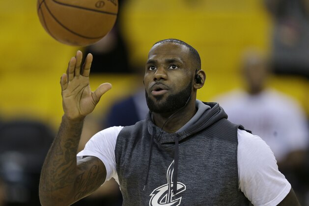 Cleveland Cavaliers forward LeBron James warms up before Game 2 of basketball's NBA Finals against the Golden State Warriors in Oakland, Calif., Sunday, June 4, 2017. (AP Photo/Ben Margot)