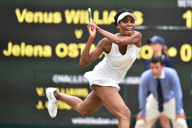 US player Venus Williams returns against Latvia's Jelena Ostapenko during their women's singles quarter-final match on the eighth day of the 2017 Wimbledon Championships at The All England Lawn Tennis Club in Wimbledon, southwest London, on July 11, 2017. / AFP PHOTO / Glyn KIRK / RESTRICTED TO EDITORIAL USE        (Photo credit should read GLYN KIRK/AFP/Getty Images)