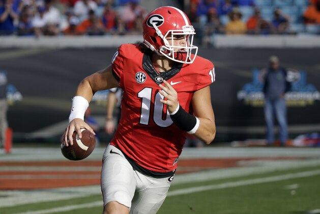 Georgia quarterback Jacob Eason looks for a receiver during the first half of an NCAA college football game against Florida , Saturday, Oct. 29, 2016, in Jacksonville, Fla. (AP Photo/John Raoux)