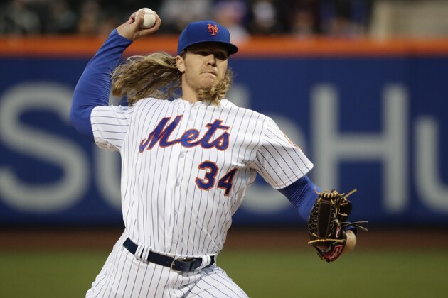 FILE - In this April 20, 2017, file photo, New York Mets' Noah Syndergaard delivers a pitch during the first inning of a baseball game against the Philadelphia Phillies, in New York. Syndergaard was scratched from his start Thursday, April 27, 2017, against the Atlanta Braves because of what manager Terry Collins said was