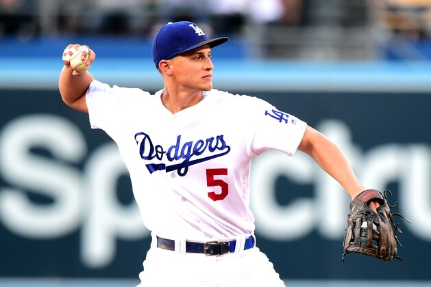 LOS ANGELES, CA - JULY 05:  Corey Seager #5 of the Los Angeles Dodgers makes a throw to first for an out of Ketel Marte #4 of the Arizona Diamondbacks during the first inning at Dodger Stadium on July 5, 2017 in Los Angeles, California.  (Photo by Harry How/Getty Images)